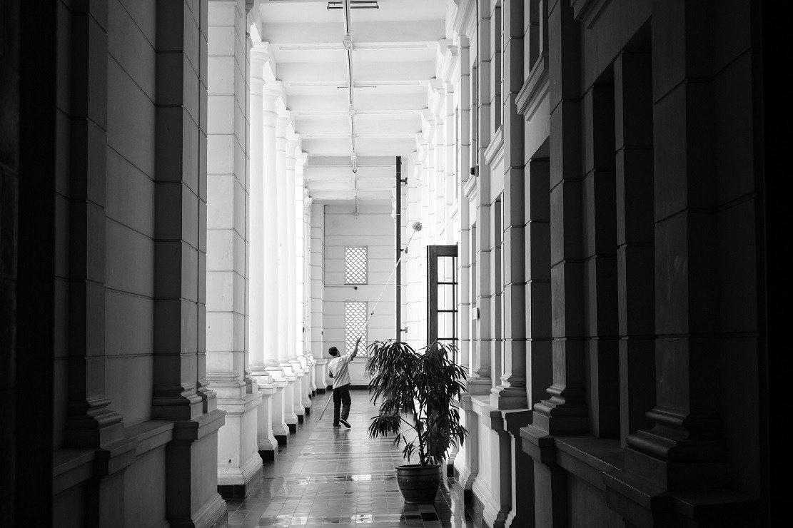 About Us 2 about us grayscale-photo-of-person-walking-on-corridor-2915155